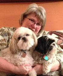 Admin Asst Anne DeHaan with Teddy (white) and Fenway the Shih Tzus. Fenway is Teddy's best friend