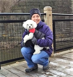 Amy and Buddy talking a winter walk in Dexter MI — with Amy Maier.