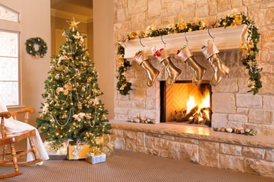 Neutral Christmas Decor around a lit fireplace