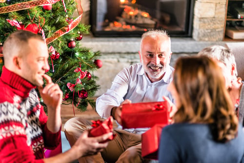 Parent giving adult children a Christmas gift