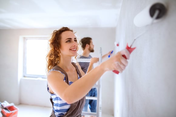 Couple painting home 