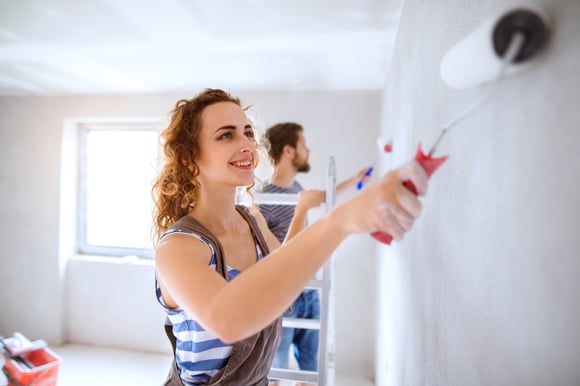 Couple painting home