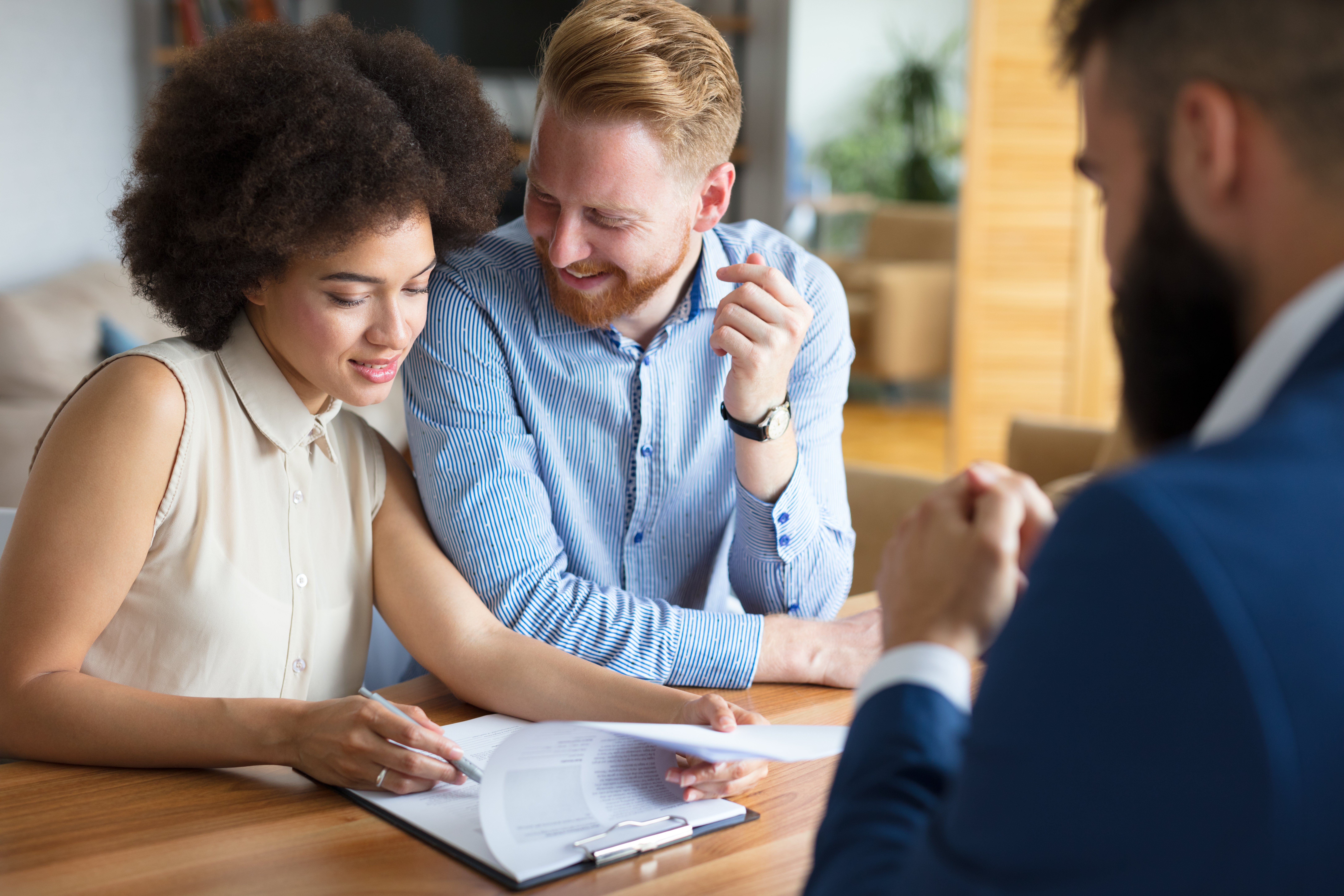 Couple signing papers on closing day